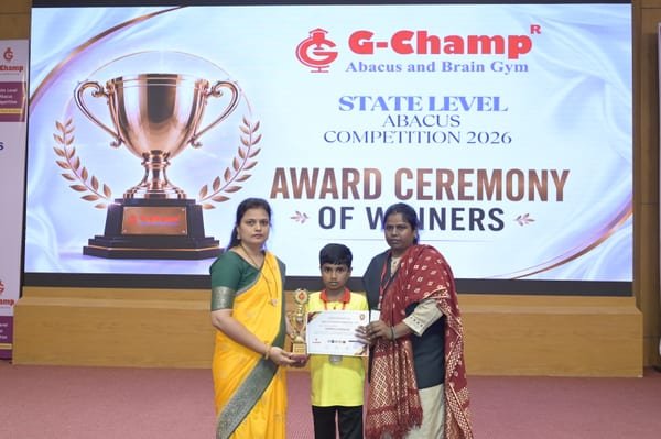 G-Champ student champion holding a trophy and certificate at the National Level Abacus Competition