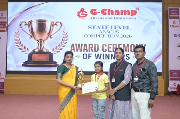 Young G-Champ abacus champion holding a trophy and award certificate