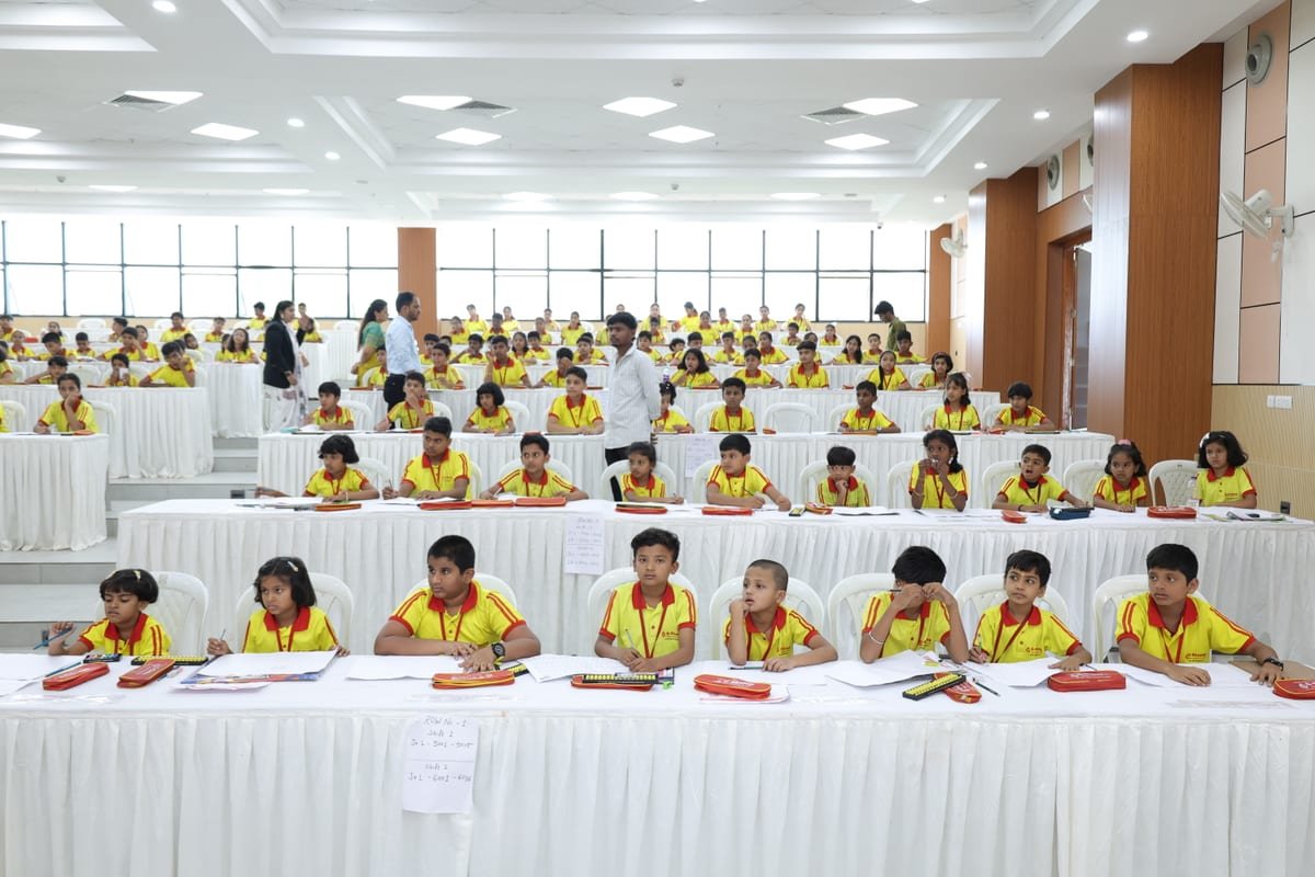 G-Champ students solving abacus calculations at desks during the State Level Abacus Competition